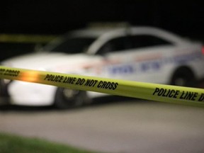 A Durham Regional Police cruiser and crime scene tape.