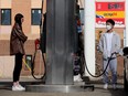 Drivers are pictured at a Petro-Canada gas station in downtown Edmonton on April 1, 2022.