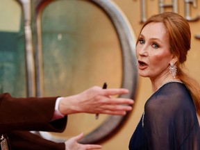 British writer J.K Rowling reacts on the red carpet after arriving to attend the World Premiere of the film "Fantastic Beasts: The Secrets of Dumbledore" in London on March 29, 2022. (Photo by TOLGA AKMEN/AFP via Getty Images)