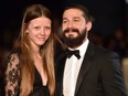 Shia LaBeouf and Mia Goth pose for photographers on the red carpet as they arrive for the European premiere of "Fury" during the closing night gala of the London Film Festival in London on Oct. 19, 2014.
