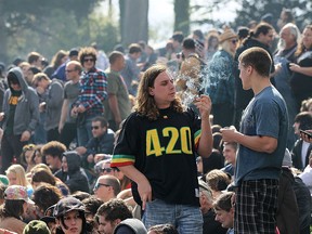 A marijuana user smokes marijuana during a 420 Day celebration on "Hippie Hill" in Golden Gate Park April 20, 2010 in San Francisco, California. (Photo by Justin Sullivan/Getty Images)