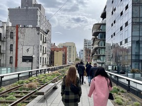 Pedestrians walk along The High Line, a 2.33-kilometre elevated trail on Manhattan’s West Side.