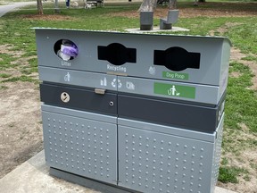 One of the waste bins that includes a "dog poop" spot at Victoria Square Memorial Park in Toronto is seen on May 15, 2021. A dog owner had just placed a bag of dog waste in the slot marked Litter.