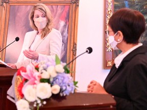 Canadian Foreign Minister Melanie Joly, left, talks with Indonesian Foreign Minister Retno Marsudi during a news conference following their meeting in Jakarta, Indonesia, April 11, 2022.
