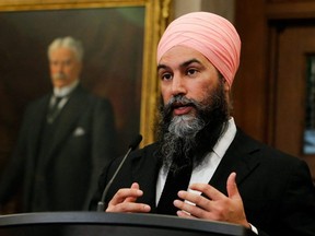 New Democratic Party Leader Jagmeet Singh reacts to the 2022-23 budget, outside the House of Commons on Parliament Hill, in Ottawa, April 7, 2022.
