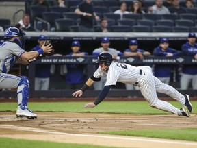 Yankees' Josh Donaldson attempts to score a run in the first inning against the Blue Jays  at Yankee Stadium in New York.
