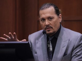 Johnny Depp testifies during his defamation trial against his ex-wife Amber Heard at the Fairfax County Circuit Courthouse in Fairfax, Va., April 20, 2022.