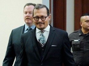 Actor Johnny Depp arrives in the courtroom after a lunch break at the Fairfax County Circuit Courthouse in Fairfax, Va., on April 18, 2022.
