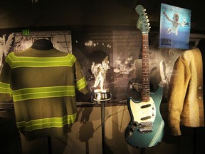 Memorabilia, including iconic clothing and musical instruments of the late Kurt Cobain of Nirvana, on display at the "Nirvana: Taking Punk to the Masses" exhibition of the Experience Music Project (EMP) in Seattle on April 15, 2011.