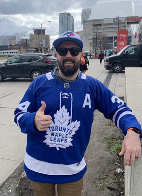 Kevin Clarke, of Cambridge, proudly wears a Toronto Blue Jays cap and Toronto Maple Leafs sweater on Saturday, April 9, 2022.