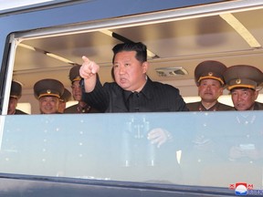 North Korean leader Kim Jong Un gestures as he watches the test-firing of a new-type tactical guided weapon according to state media in this undated photo released on April 16, 2022 by North Korea's Korean Central News Agency.