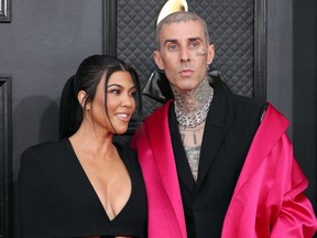 Kourtney Kardashian and Travis Barker pose on the red carpet at the 64th Annual Grammy Awards at the MGM Grand Garden Arena in Las Vegas, April 3, 2022.