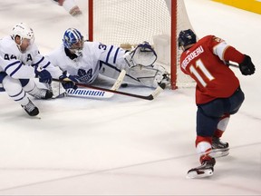 Florida Panthers left wing Jonathan Huberdeau (11) scores the game winning goal past Toronto Maple Leafs goaltender Jack Campbell (36) during the overtime period at FLA Live Arena.