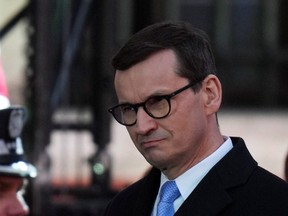 Polish Prime Minister Mateusz Morawiecki looks on as he attends an event with U.S. President Joe Biden, amid Russia's invasion of Ukraine, at the Royal Castle in Warsaw, Poland, March 26, 2022.