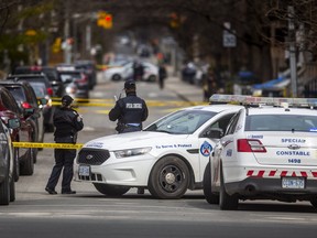 Toronto Police at the scene of a homicide investigation at Ontario St. and Shuter St. in Toronto, Ont. on Sunday, April 3, 2022.