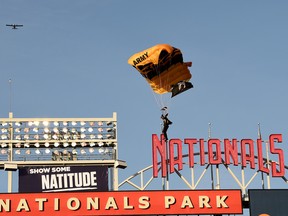 A member of the U.S. Army Parachute Team, the Golden Knights, lands at Nationals Park on April 20, 2022 in Washington.