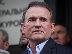 Viktor Medvedchuk, leader of Opposition Platform - For Life political party, speaks with journalists outside the office of the Prosecutor General in Kyiv, Ukraine May 12, 2021.
