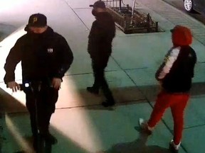 An image released by Toronto Police of three men sought in an April 3, 2022 break-and-enter at a commercial building at Queen and Spadina.
