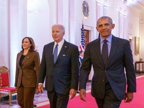 U.S. Vice-President Kamala Harris, U.S. President Joe Biden, and former president Barack Obama arrive to deliver remarks on the Affordable Care Act and Medicaid in the East Room of the White House in Washington, D.C., on April 5, 2022.