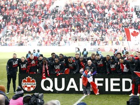 Canada celebrates after the final whistle following a 2022 World Cup qualifying match against Jamaica at BMO Field on March 27, 2022 in Toronto.