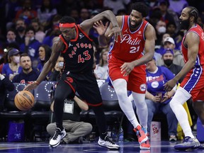 Pascal Siakam #43 of the Toronto Raptors and Joel Embiid #21 of the Philadelphia 76ers challenge for the ball during the fourth quarter of Game Two of the Eastern Conference First Round at Wells Fargo Center in Philadelphia, Pennsylvania.