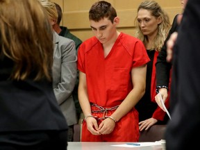 Nikolas Cruz, facing 17 charges of premeditated murder in the mass shooting at Marjory Stoneman Douglas High School in Parkland, appears in court for a status hearing in Fort Lauderdale, Fla., Feb. 19, 2018.
