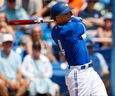 Toronto Blue Jays centre fielder George Springer (4) singles in the first inning against the New York Yankees during spring training at TD Ballpark.