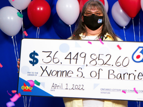Yvonne Sauve with her Lotto 6/49 winnings.