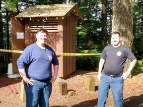 The Brinnon Fire Department wrote about the whole nauseating experience on their Facebook post with two firefighters posing outside the toilet.