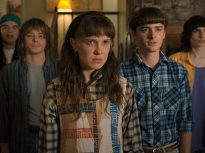 (L to R) Eduardo Franco as Argyle, Charlie Heaton as Jonathan, Millie Bobby Brown as Eleven, Noah Schnapp as Will Byers, and Finn Wolfhard as Mike Wheeler in Stranger Things.