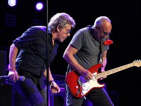 Roger Daltrey (left) looks on as Pete Townshend plays guitar as The Who perform at MTS Centre in Winnipeg on Wed., May 4, 2016.