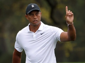 Tiger Woods of the United States gestures during a practice round prior to the Masters at Augusta National Golf Club on April 6, 2022 in Augusta, Ga.