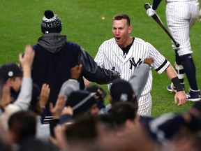 Todd Frazier of the New York Yankees celebrates after a go ahead run during the eighth inning against the Houston Astros in Game Four of the American League Championship Series at Yankee Stadium on Oct. 17, 2017 in the Bronx borough of New York City.