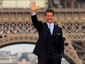Cast member Tom Cruise poses in front the Eiffel Tower during the world premiere of the film "Mission: Impossible - Fallout" in Paris, France, July 12, 2018.