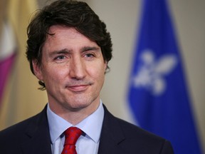 Prime Minister Justin Trudeau speaks with the media as he highlights his government's new budget during a visit to Laval, Que., April 13, 2022.