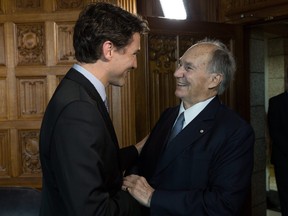In this handout photo from the Prime Minister's Office, Prime Minister Trudeau meets with the Aga Khan in his Centre Block office in Ottawa on May 17, 2016.