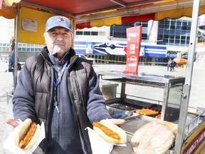 George Mitzithras is pictured in front of his hot dog stand outside the Rogers Centre as the Toronto Blue Jays prepare for the upcoming season on April 7, 2022.