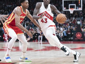 Toronto Raptors forward Pascal Siakam (43) controls the ball as Atlanta Hawks forward De'Andre Hunter (12) tries to defend during the fourth quarter at Scotiabank Arena.