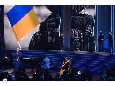 US singer-songwriter John Legend (R) and Ukrainian musician Siuzanna Iglidan (L) perform onstage during the 64th Annual Grammy Awards at the MGM Grand Garden Arena in Las Vegas on April 3, 2022. (Photo by VALERIE MACON / AFP)