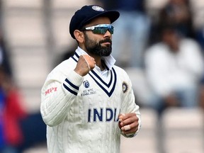 In this file photo taken on June 22, 2021, India's Virat Kohli celebrates taking the wicket of New Zealand's captain Kane Williamson (unseen) for 49 runs on the fifth day of the ICC World Test Championship Final between New Zealand and India at the Ageas Bowl in Southampton, southwest England.