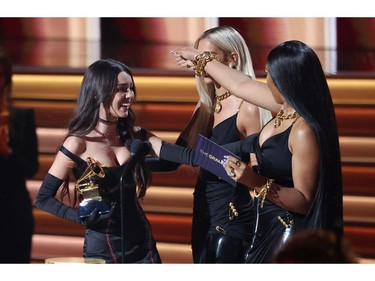 Olivia Rodrigo accepts the Best New Artist award from presenters Dua Lipa and Megan Thee Stallion during the 64th Annual Grammy Awards show at the MGM Grand Garden Arena in Las Vegas, Nevada, U.S., April 3, 2022. REUTERS/Mario Anzuoni