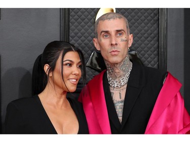 Kourtney Kardashian and Travis Barker pose on the red carpet at the 64th Annual Grammy Awards at the MGM Grand Garden Arena in Las Vegas, Nevada, U.S., April 3, 2022. REUTERS/Maria Alejandra Cardona