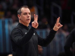 Los Angeles Lakers head coach Frank Vogel signals in the second quarter against the Denver Nuggets at Ball Arena.