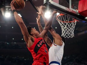 Apr 10, 2022; New York, New York, USA; Toronto Raptors forward Scottie Barnes drives to the basket against New York Knicks forward Obi Toppin (1) during the first half at Madison Square Garden.