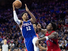 Apr 25, 2022; Philadelphia, Pennsylvania, USA; Philadelphia 76ers forward Tobias Harris (12) shoots against Toronto Raptors forward OG Anunoby (3) during the third quarter in game five of the first round for the 2022 NBA playoffs at Wells Fargo Center.
