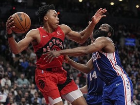 Apr 7, 2022; Toronto, Ontario, CAN; Toronto Raptors forward Scottie Barnes goes to pass the ball as Philadelphia 76ers guard James Harden defends during the second half at Scotiabank Arena.