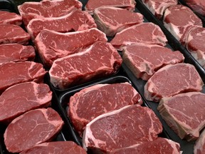 FILE PHOTO: Steaks and other beef products on display at a grocery store.
