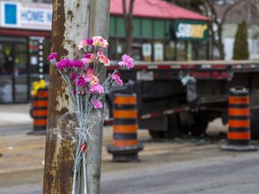 Flowers at the scene the day after a triple-fatal collision along Lake Shore Blvd. W. and Superior Ave. — east of Royal York Rd. — in Mimico in Toronto, Ont. on Friday, April 1, 2022.