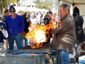 Bruce Odell, a three-time Pottery Olympics champion, shows off his unique style at the Orange Beach Festival of Art.
