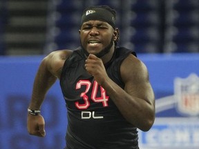 Mar 5, 2022; Indianapolis, IN, USA; Penn State defensive lineman Jesse Luketa (DL34) runs the 40-yard dash during the 2022 NFL Scouting Combine at Lucas Oil Stadium.